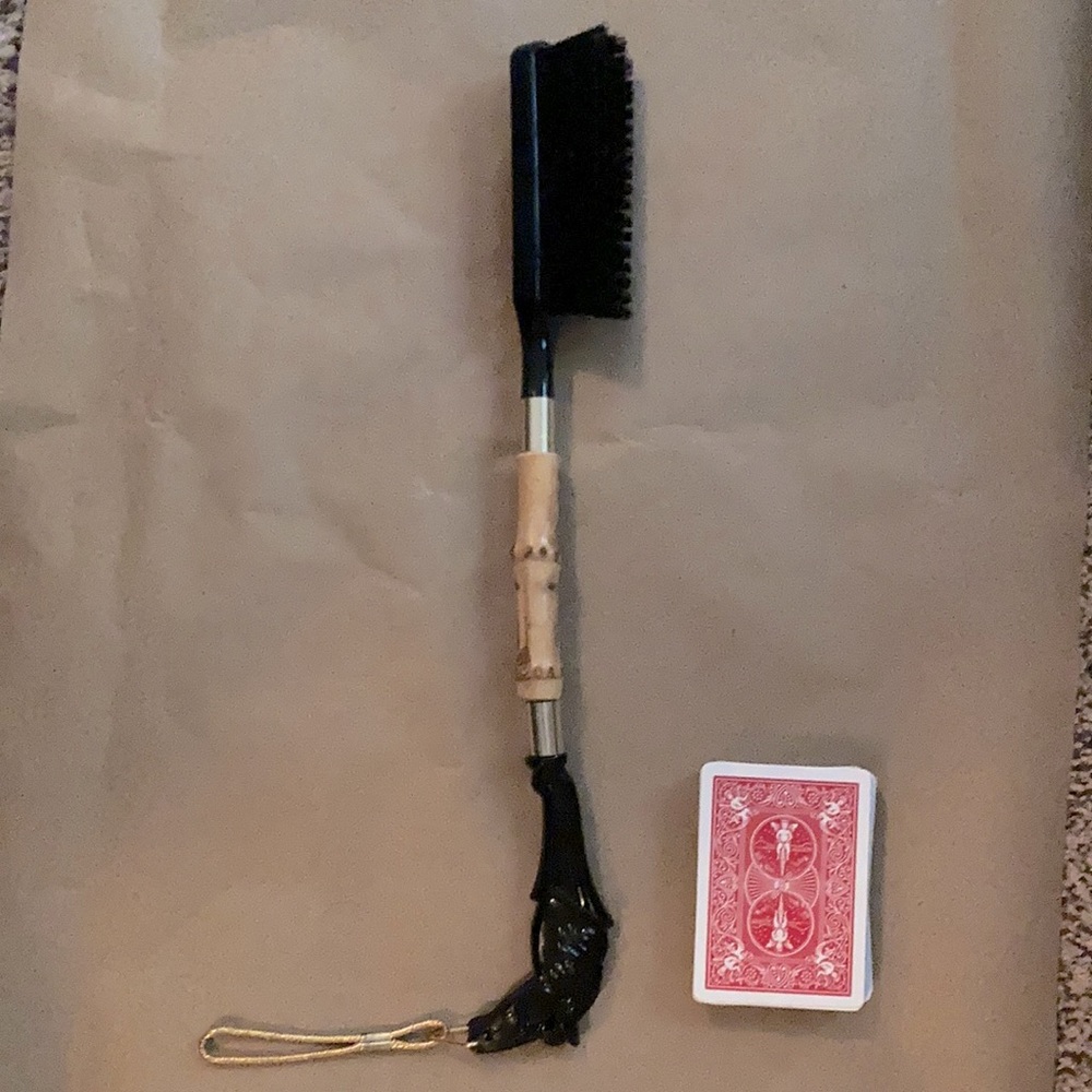 1960’s horse headed, bamboo handled, lint brush
